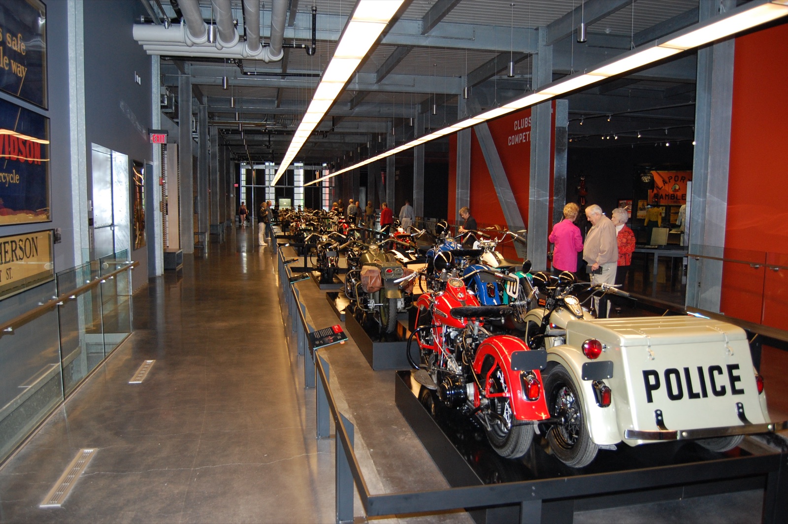 Harley-Davidson Museum gallery floor lined with vintage motorcycles arranged in chronological procession
